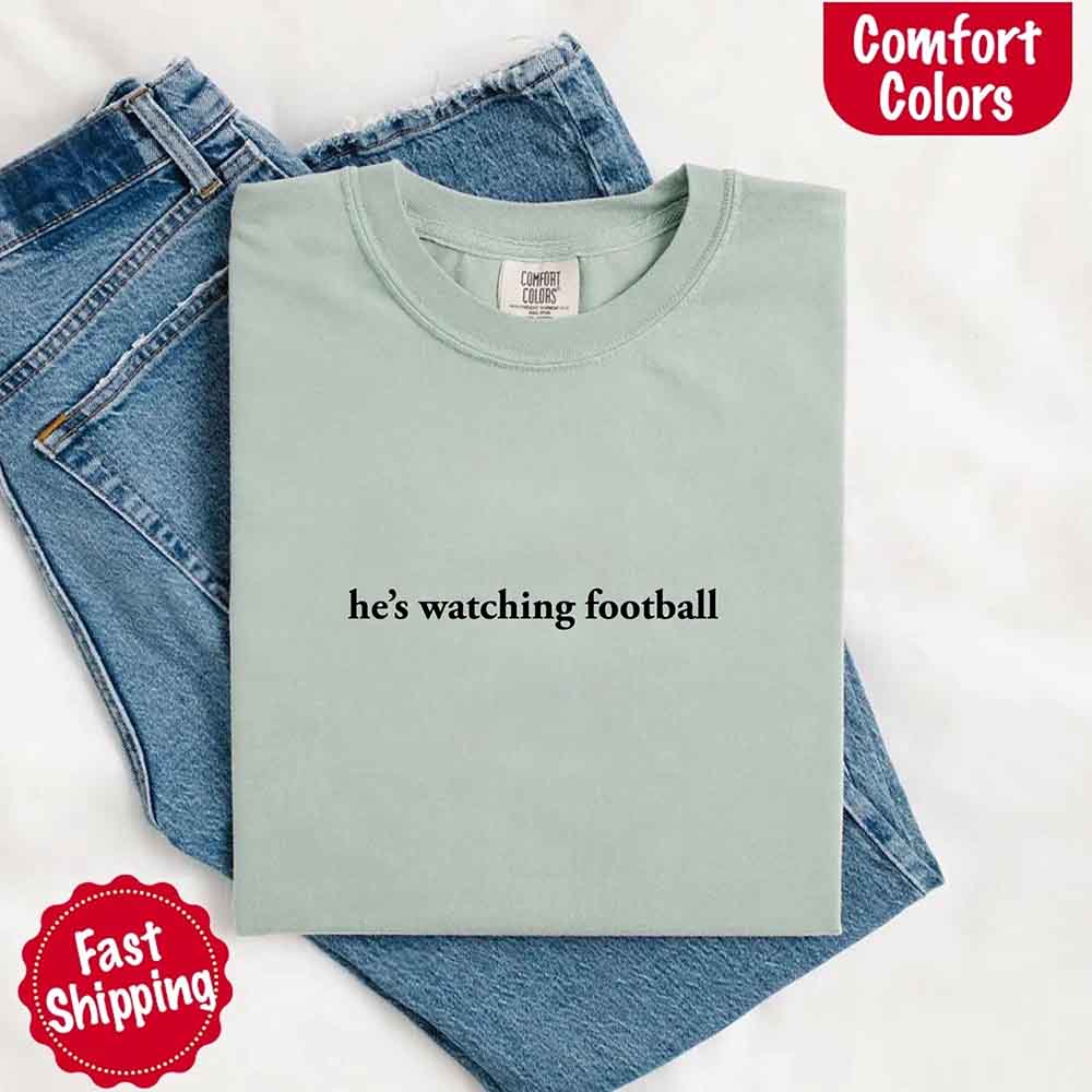 He's Watching Football Comfort Colors Funny Tee for Her
