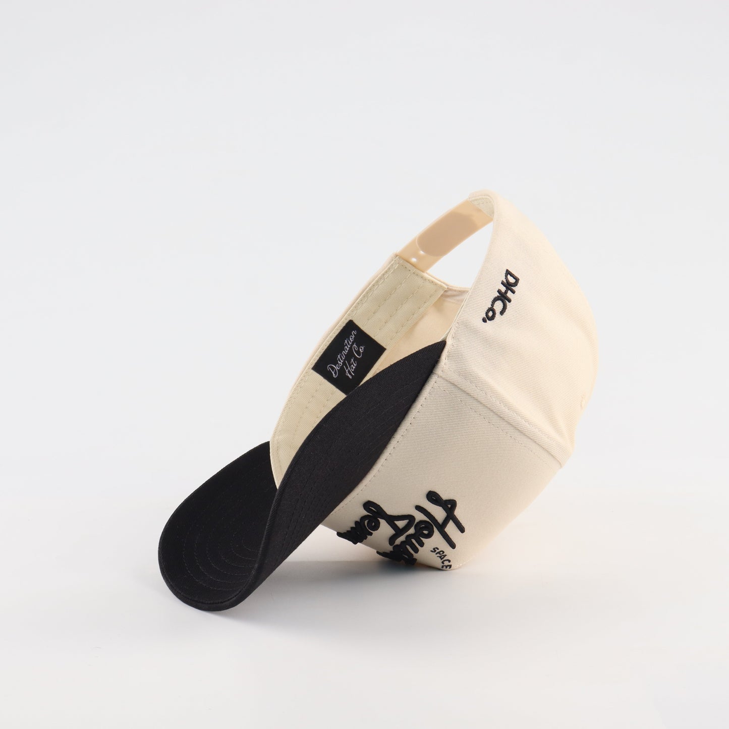 Houston Script Beige and Black Pre-curved Trucker Hat Destination Hat Co.