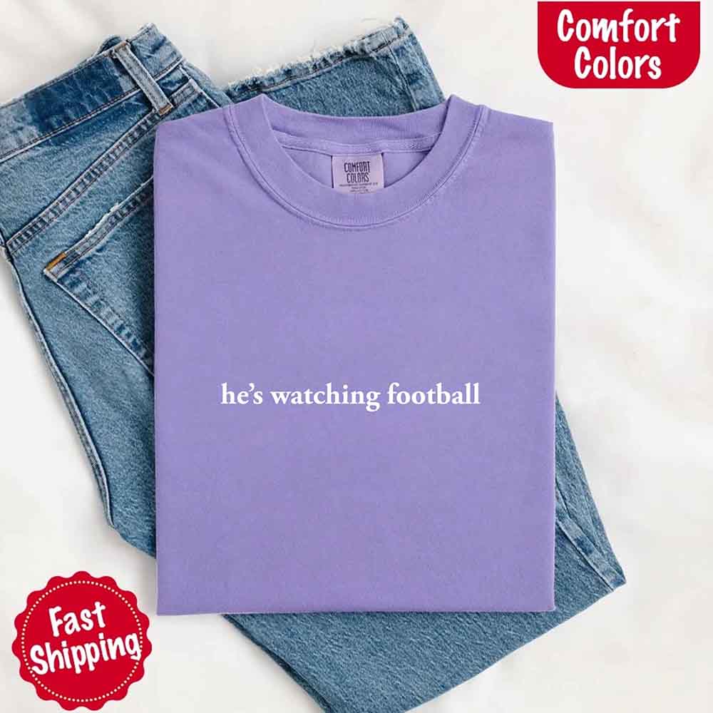 He's Watching Football Comfort Colors Funny Tee for Her