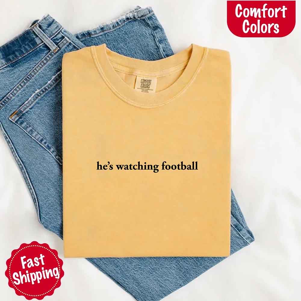He's Watching Football Comfort Colors Funny Tee for Her