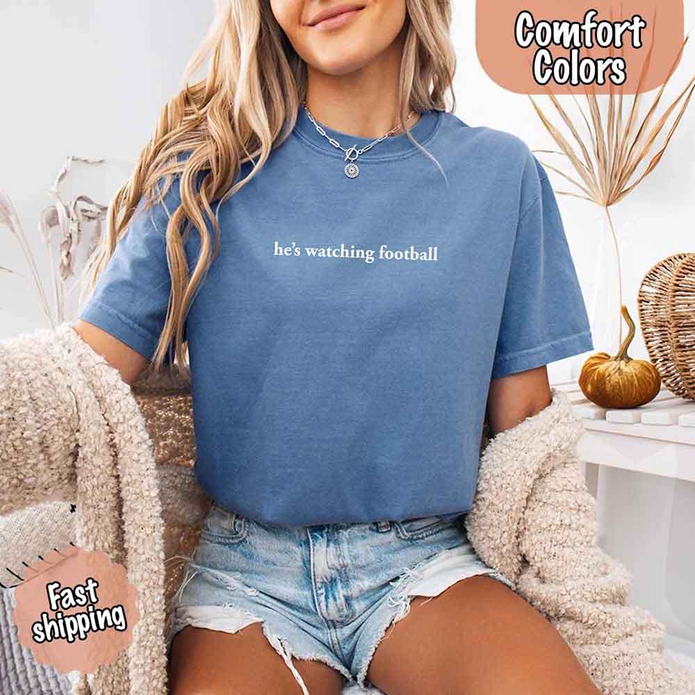 He's Watching Football Comfort Colors Funny Tee for Her