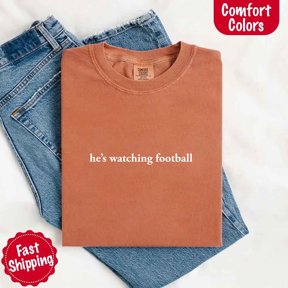 He's Watching Football Comfort Colors Funny Tee for Her