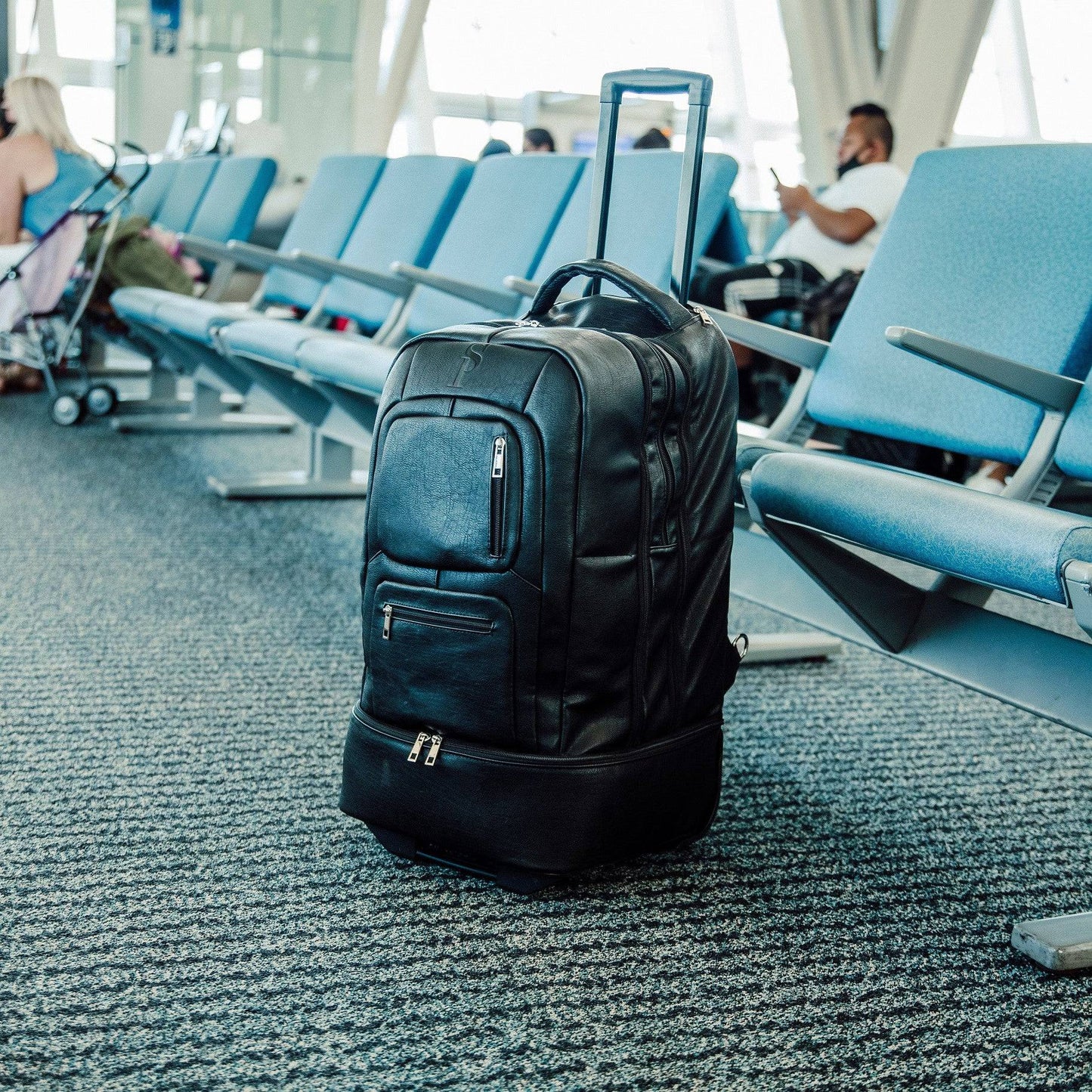 Black Leather TSA-Approved Carry-On Roller Bag Sole Premise