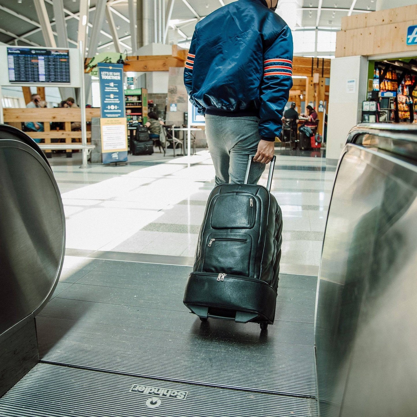 Black Leather TSA-Approved Carry-On Roller Bag Sole Premise