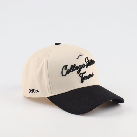 College Station Script Beige and Black Pre-curved Trucker Hat Destination Hat Co.