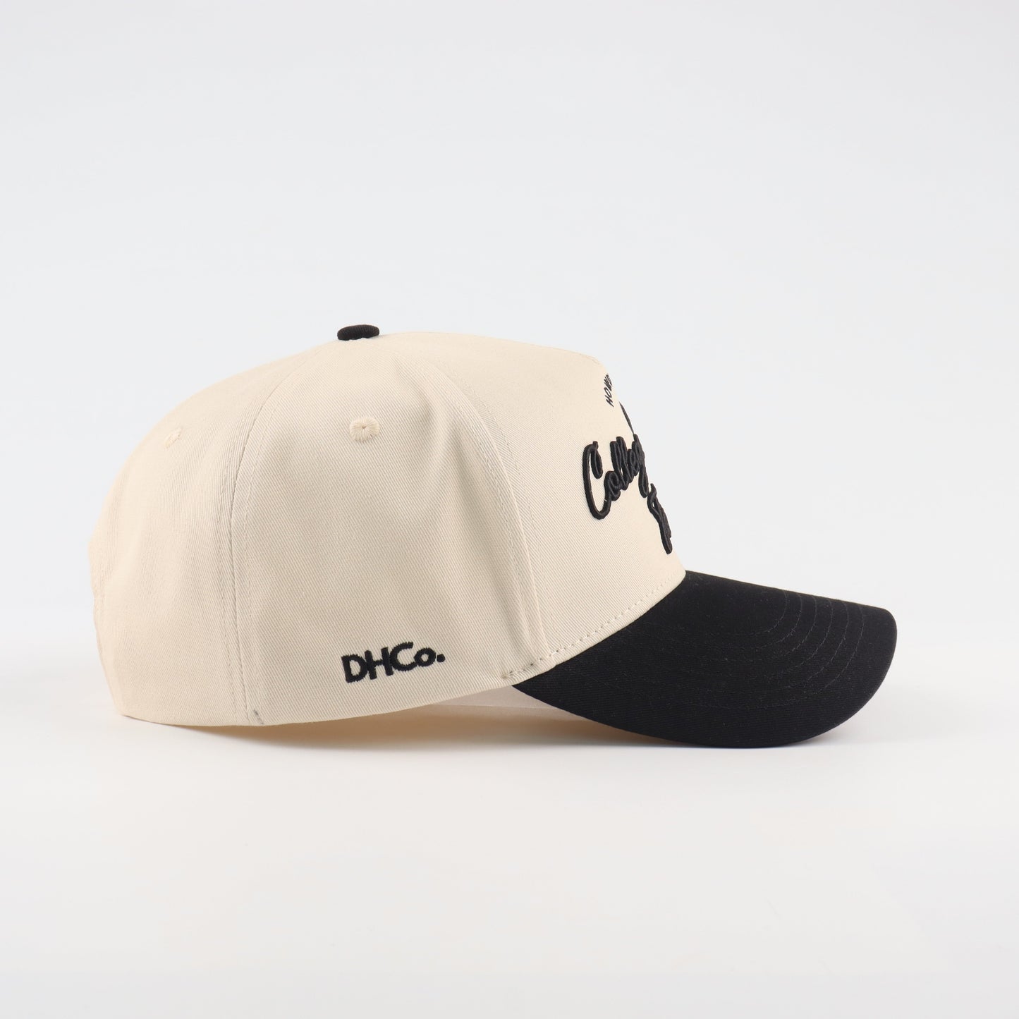 College Station Script Beige and Black Pre-curved Trucker Hat Destination Hat Co.