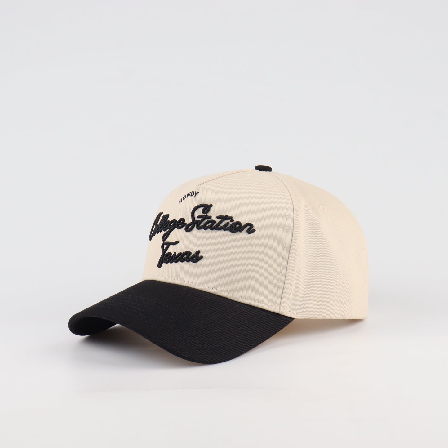 College Station Script Beige and Black Pre-curved Trucker Hat Destination Hat Co.