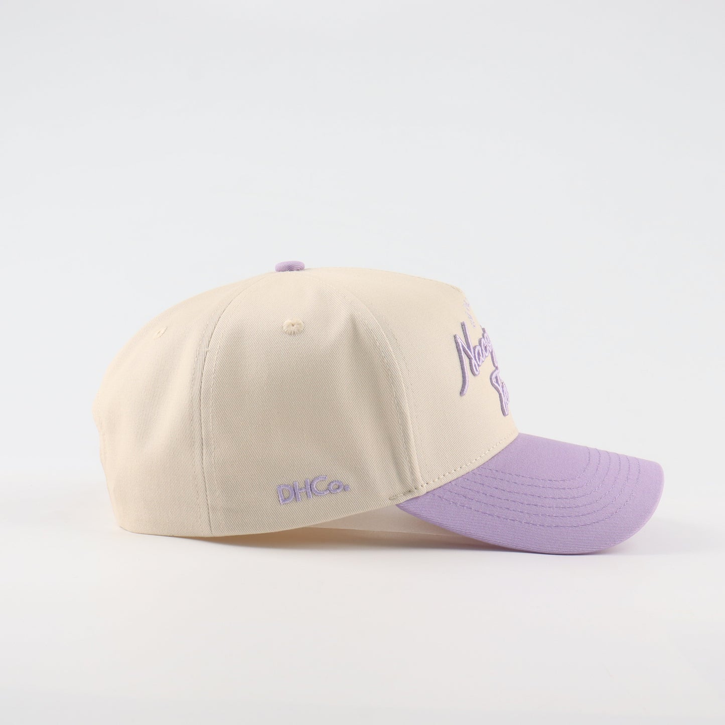 Nacogdoches Script Beige and Purple Pre-curved Trucker Hat