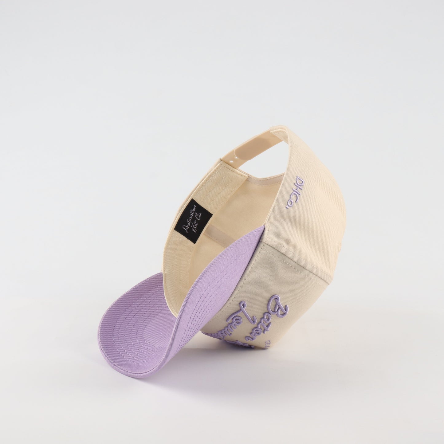 Script Hat Beige Purple Pre-Curved Trucker Hat Destination Hat Co.
